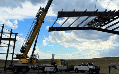 Raising the Roof and the Bar: How We Use Construction Cranes for Metal Building Erection